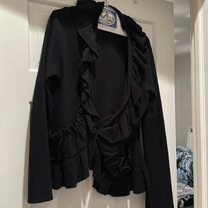 Like new, black sweater with ruffled neckline and pockets.